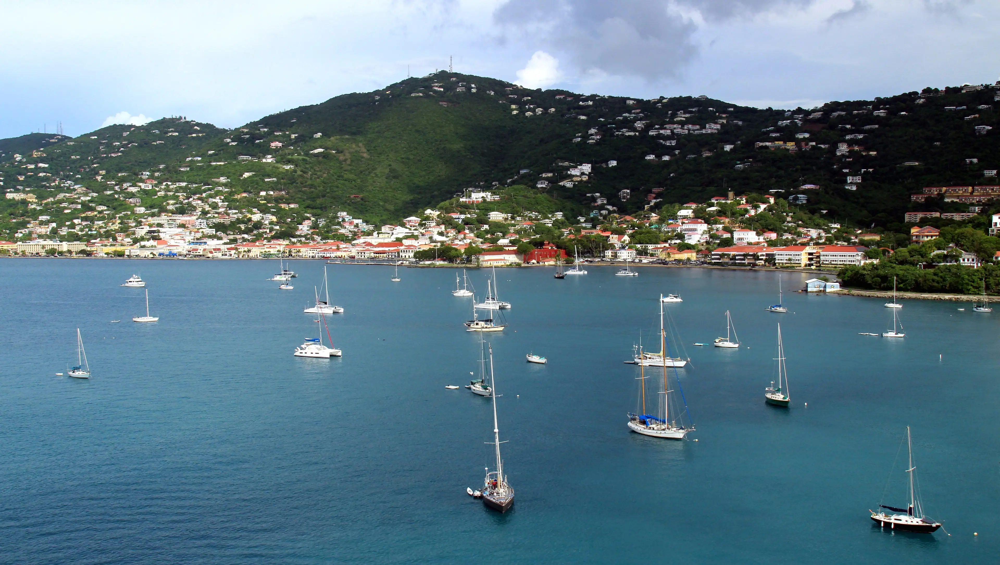 Sailboats anchored in Long Bay below the hillside homes of Charlotte Amalie